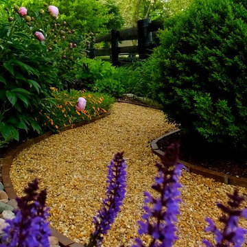 meandering pea gravel path with brick border