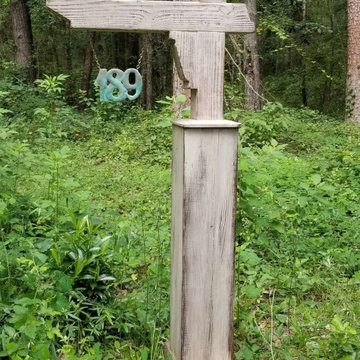 Rustic mailbox with the copper roof and custom flag