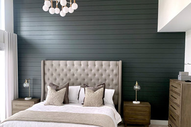 Bedroom - large modern master carpeted, beige floor, vaulted ceiling and wall paneling bedroom idea in Vancouver with white walls
