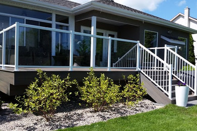 Inspiration for a mid-sized timeless backyard patio remodel in Other with decking and no cover