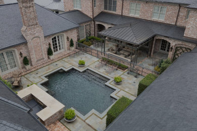 Design ideas for a huge transitional full sun courtyard stone and stone fence landscaping in Houston for fall.