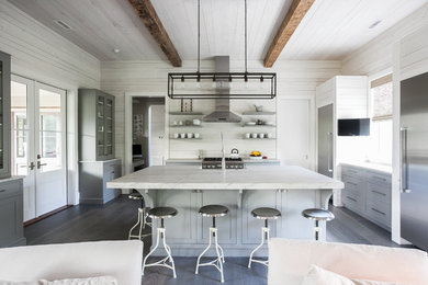 Open concept kitchen - transitional dark wood floor open concept kitchen idea in Charleston with open cabinets, gray cabinets, stainless steel appliances, an island, marble countertops, white backsplash and wood backsplash