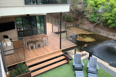 Example of an arts and crafts deck design in Dallas