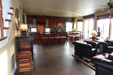 Mid-sized zen l-shaped open concept kitchen photo in Sacramento with raised-panel cabinets, an island, dark wood cabinets, multicolored backsplash and stainless steel appliances