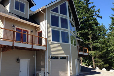 Inspiration for a craftsman beige three-story concrete fiberboard exterior home remodel in Seattle