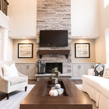 Living Room Remodel Featuring a Ledgestone Fireplace + Cabinetry + Shaw Coretec