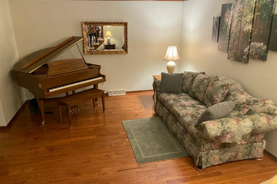 Living room - mid-sized traditional medium tone wood floor and brown floor living room idea in Sacramento