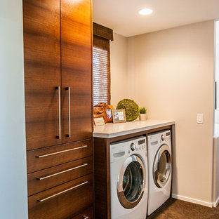 Design ideas for a small contemporary single-wall separated utility room in Salt Lake City with flat-panel cabinets, dark wood cabinets, engineered stone countertops, beige walls, a side by side washer and dryer and carpet.