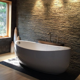 Bathroom - large industrial master black tile and porcelain tile bamboo floor bathroom idea in Other with a two-piece toilet, white walls, a trough sink and concrete countertops