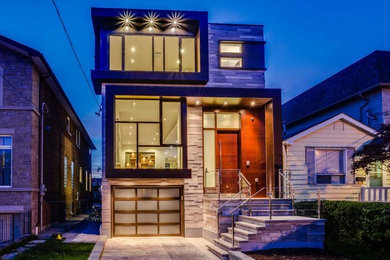 Mid-sized minimalist brown three-story mixed siding flat roof photo in Toronto