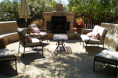 Example of a mid-sized transitional backyard concrete patio design in Los Angeles with a fire pit and no cover