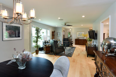 Living room - large transitional open concept light wood floor living room idea in Other with gray walls