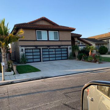 Front Renovation Completed – Modern Garage Doors & Stone Exterior