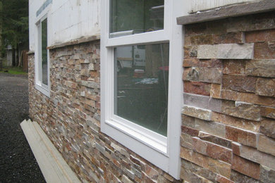 Inspiration for a stone exterior home remodel in Seattle