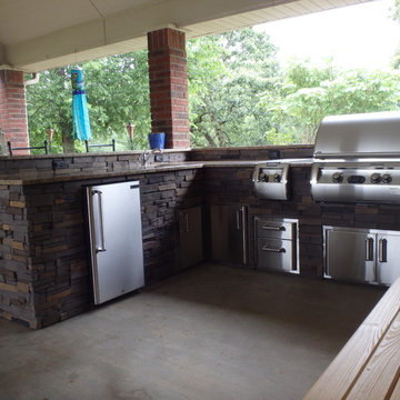 L Shaped Outdoor Kitchen With Unique Lighting