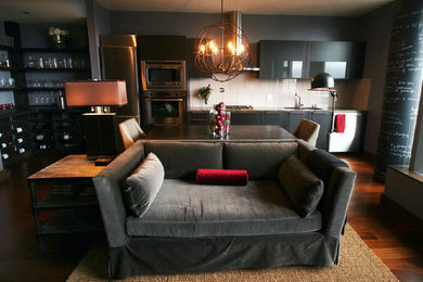 Living room - mid-sized contemporary open concept dark wood floor and brown floor living room idea in Seattle with brown walls, a standard fireplace and a stone fireplace