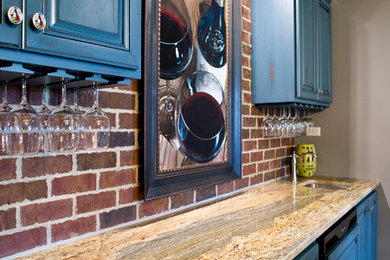 Minimalist single-wall wet bar photo in Other with an undermount sink, raised-panel cabinets, blue cabinets, granite countertops, multicolored backsplash and brick backsplash