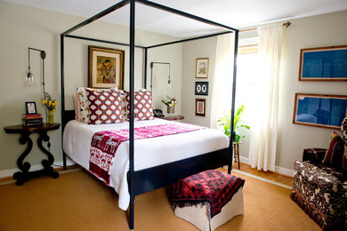 Mid-sized eclectic master medium tone wood floor bedroom photo in Other with beige walls