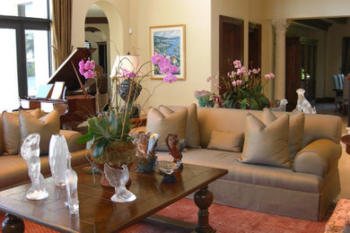 Family room - large mediterranean open concept carpeted family room idea in Miami with beige walls, no fireplace and no tv