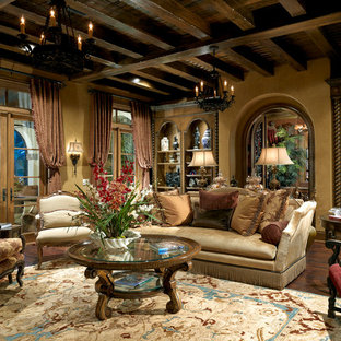 Design ideas for a large mediterranean formal enclosed living room in Orlando with yellow walls, dark hardwood flooring, no fireplace, no tv and brown floors.