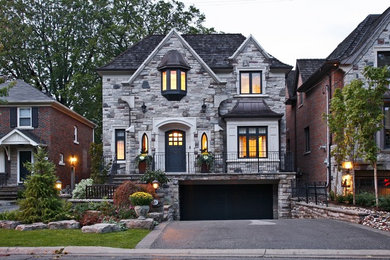 This is an example of a traditional exterior in Toronto with stone veneer.