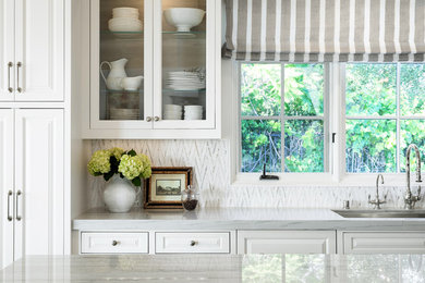 Example of a large transitional u-shaped travertine floor and beige floor eat-in kitchen design in San Diego with an undermount sink, beaded inset cabinets, white cabinets, quartzite countertops, white backsplash, marble backsplash, stainless steel appliances, an island and white countertops