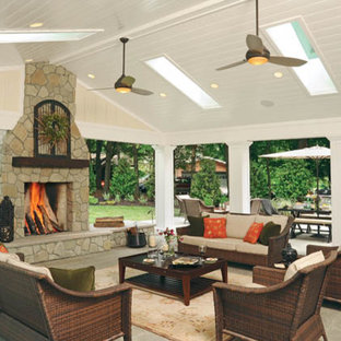 This is an example of an expansive traditional backyard full sun garden for fall in Columbus with a fire feature and brick pavers.