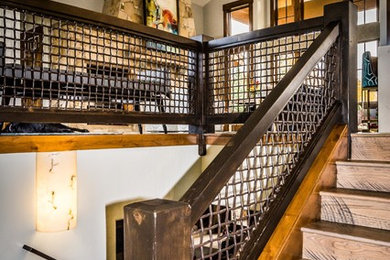 Inspiration for a mid-sized contemporary wood u-shaped staircase in Salt Lake City with wood risers and mixed railing.
