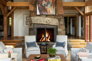 Living room - rustic open concept brown floor, vaulted ceiling and wood ceiling living room idea in Charlotte with white walls, a standard fireplace and a stone fireplace