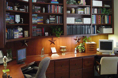 Inspiration for a mid-sized timeless built-in desk study room remodel in Austin with beige walls
