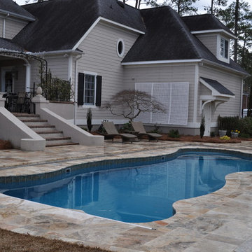 Fiberglass Swimming Pool with Travertine Decking and Automatic Cover