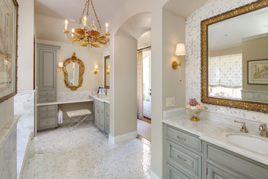 Large elegant master white tile and marble tile mosaic tile floor, white floor, double-sink and wainscoting bathroom photo in San Diego with beaded inset cabinets, gray cabinets, an undermount tub, a bidet, beige walls, an undermount sink, quartzite countertops, a hinged shower door, white countertops and a built-in vanity