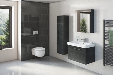 This is an example of a mid-sized contemporary bathroom in Cheshire with dark wood cabinets, a wall-mount toilet, black tile, stone slab and porcelain floors.