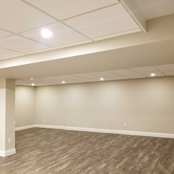 Refinished Basement with Baby Blue Walk-Up Bar