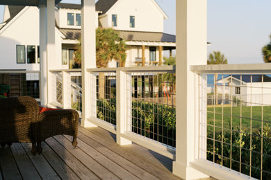 Beach style home design photo in Other