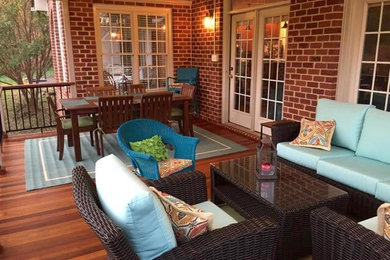Mid-sized elegant back porch photo in Other with decking and a roof extension
