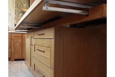 Inspiration for a mid-sized craftsman u-shaped porcelain tile kitchen pantry remodel in Atlanta with an undermount sink, shaker cabinets, medium tone wood cabinets, concrete countertops, brown backsplash, glass tile backsplash, stainless steel appliances and an island