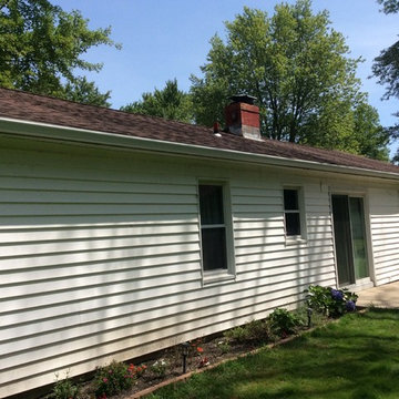 Replaced valleys and rotted plywood, installed new 5 inch gutters and guards