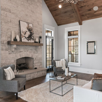 Luxury Modern Farmhouse Lower Level with Stone Fireplaces & Pool Views