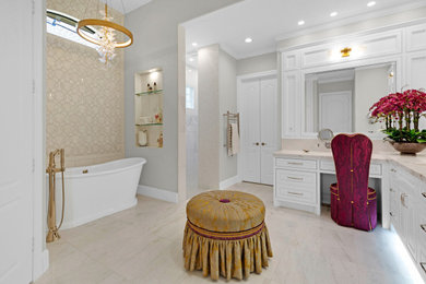 Large transitional master white tile and marble tile marble floor, white floor and double-sink bathroom photo in Houston with raised-panel cabinets, white cabinets, beige walls, a drop-in sink, marble countertops, beige countertops and a built-in vanity