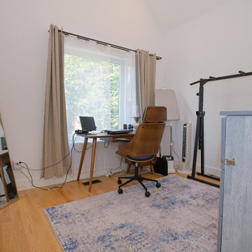 Bright Home Office with Wood Desk, Large Window and Exercise Area | East York