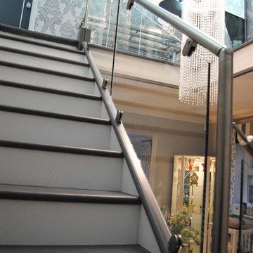 Grey, Steel and Glass Staircase Renovation