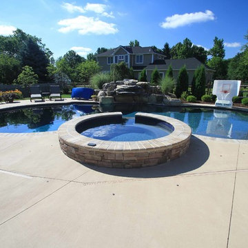 Custom Freeform style salt water in ground pool with Pool House and Raised Spa