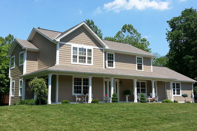 Large elegant beige two-story wood house exterior photo in Cincinnati