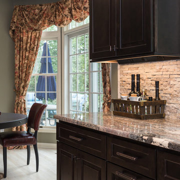Hidden outlets and LED recessed lighting in a split rock backsplash