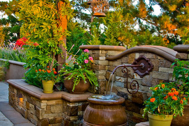 Design ideas for a mediterranean water fountain landscape in Orange County.