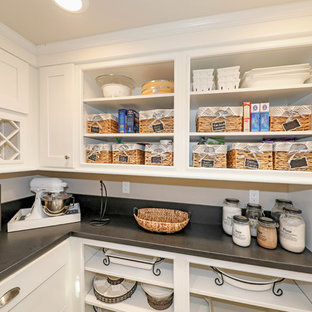 Small transitional kitchen pantry inspiration - Inspiration for a small transitional l-shaped kitchen pantry remodel in Orange County with shaker cabinets and white cabinets