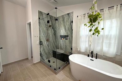 Example of a large master porcelain tile porcelain tile, beige floor and double-sink bathroom design in DC Metro with dark wood cabinets, a built-in vanity, a one-piece toilet, white walls, marble countertops, a hinged shower door and white countertops
