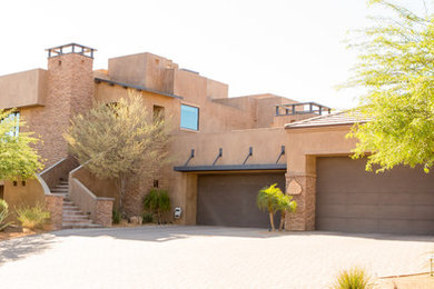 Large contemporary beige two-story stucco exterior home idea in Phoenix
