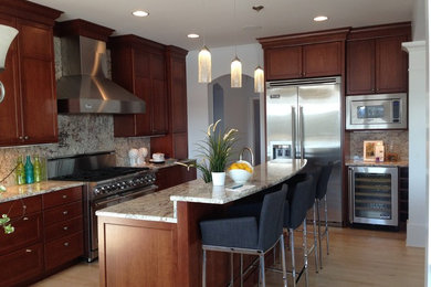 Mid-sized elegant single-wall light wood floor and beige floor eat-in kitchen photo in Minneapolis with shaker cabinets, dark wood cabinets, granite countertops, multicolored backsplash, stainless steel appliances and an island